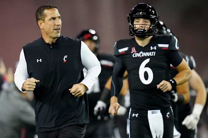 Cincinnati head coach Luke Fickell running out of the tunnel with the Bearcats.
