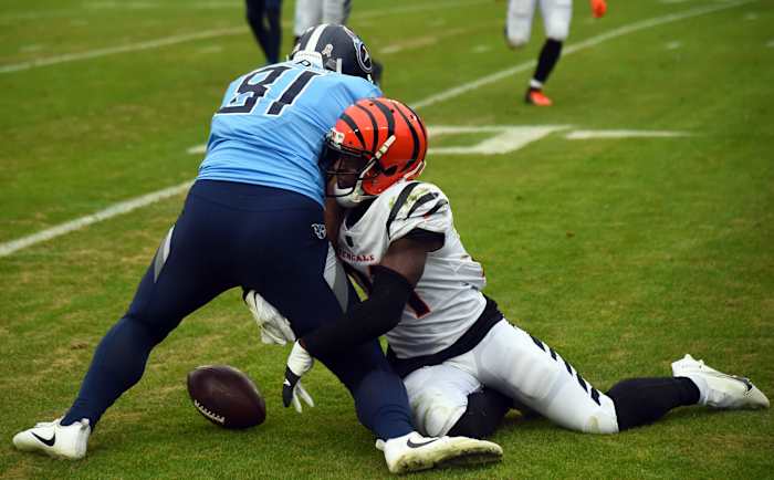 Nov 27, 2022; Nashville, Tennessee, USA; Cincinnati Bengals cornerback Mike Hilton (21) breaks up a pass intended for Tennessee Titans tight end Austin Hooper (81) during the first half at Nissan Stadium. Mandatory Credit: Christopher Hanewinckel-USA TODAY Sports