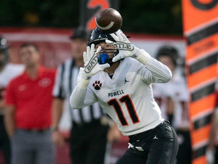 Ayden Greene catching a pass for Powell High School.