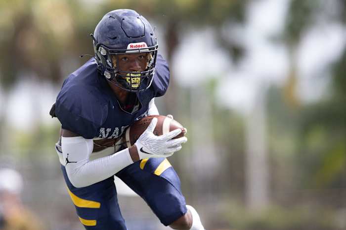 Naples (Fla.) cornerback Jonas Duclona running with the football.