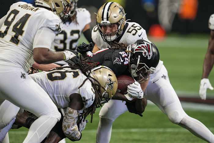 Sep 11, 2022; New Orleans Saints linebackers Kaden Elliss (55) and Demario Davis (56) tackle Atlanta Falcons running back Cordarrelle Patterson (84). Mandatory Credit: Dale Zanine-USA TODAY Sports