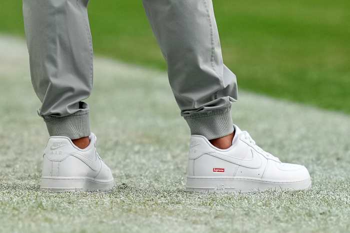 View of Coach Mike McDaniel's white shoes.