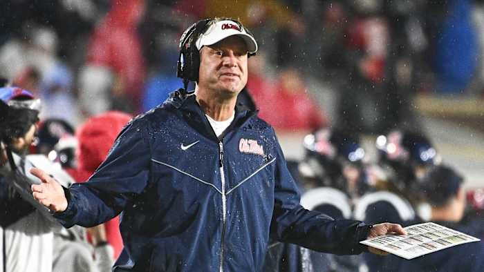 Ole Miss coach Lane Kiffin spreads his arms on the sideline