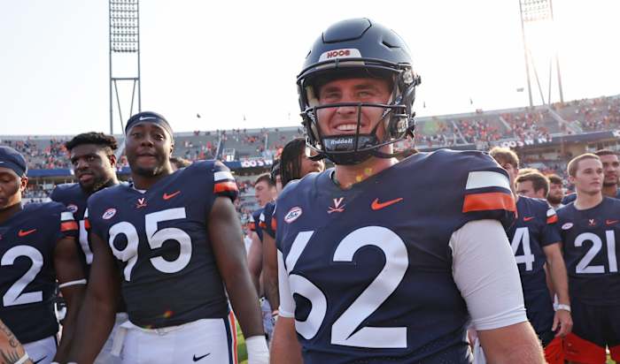 Virginia Cavaliers fifth-year long-snapper Lee Dudley celebrates with his teammates after UVA's win over Old Dominion at Scott Stadium.