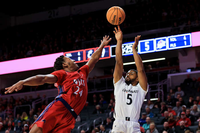 Nov 30, 2022; Cincinnati, Ohio, USA; Cincinnati Bearcats guard David DeJulius (5) shoots the ball against N.J.I.T Highlanders guard Mekhi Gray (24) in the first half at Fifth Third Arena. Mandatory Credit: Aaron Doster-USA TODAY Sports