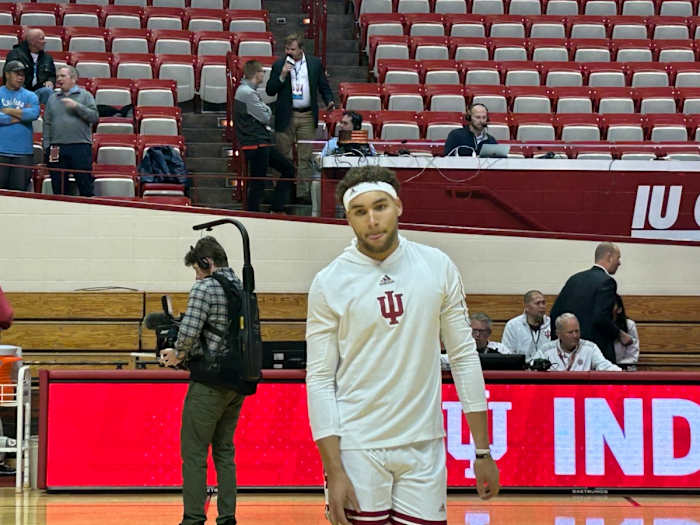 Race Thompson warms up donning his now famous headband ahead of the UNC game.