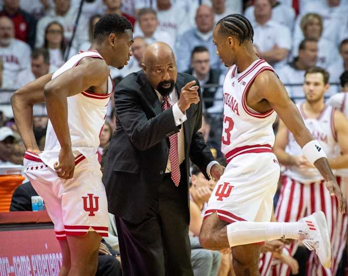 Indiana Head Coach Mike Woodson talks with Jordan Geronimo (22) and Tamar Bates (53) during the Indiana versus North Carolina men's basketball game.