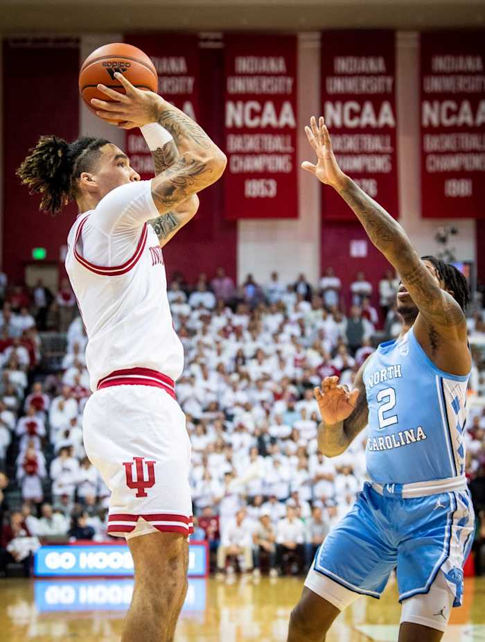 Indiana's Jalen Hood-Schifino (1) scores over North Carolina's Caleb Love (2) during the Indiana versus North Carolina men's basketball game at Simon Skjodt Assembly Hall on Wednesday, Nov. 30, 2022.