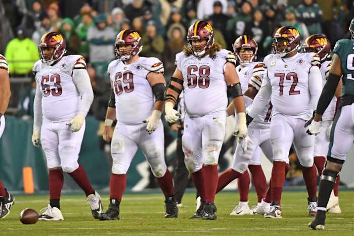 Nov 14, 2022; Philadelphia, Pennsylvania, USA; Washington Commanders guard Trai Turner (53), center Tyler Larsen (69), guard Andrew Norwell (68), and offensive tackle Charles Leno Jr. (72) against the Philadelphia Eagles at Lincoln Financial Field.