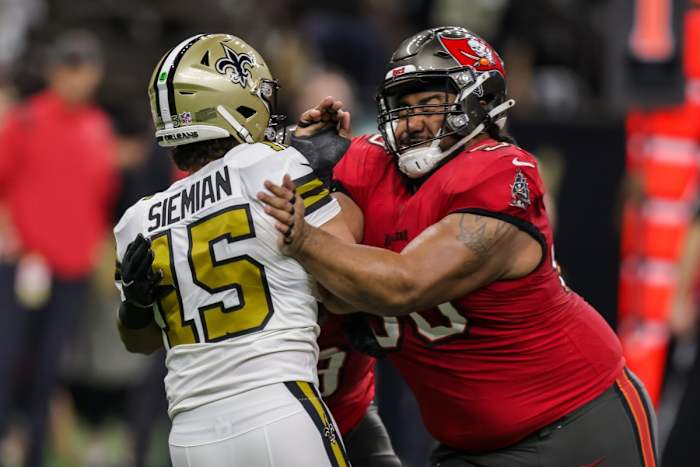 Oct 31, 2021; Tampa Bay Buccaneers defensive tackle Vita Vea (50) hits New Orleans Saints quarterback Trevor Siemian (15) after a pass. Mandatory Credit: Stephen Lew-USA TODAY