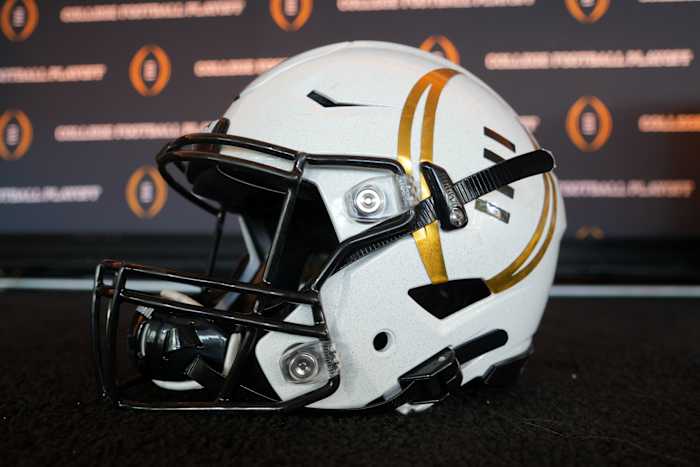 A detailed view of a helmet with the College Football Playoff logo at CFP press conference at Banc of California Stadium.