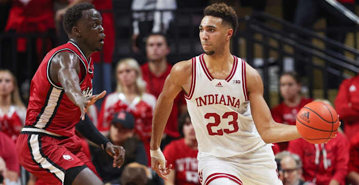 Indiana forward Trayce Jackson-Davis (23) passes the ball against Rutgers forward Mawot Mag (3) on Saturday. (Vincent Carchietta-USA TODAY Sports)
