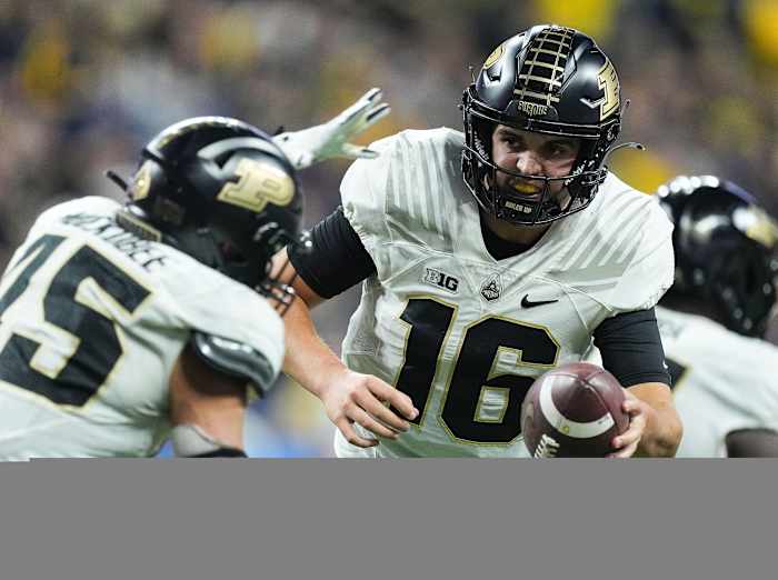 Purdue Boilermakers quarterback Aidan O'Connell (16) hands off the ball to Purdue Boilermakers running back Devin Mockobee (45) during the Big Ten football championship on Saturday, Dec. 3, 2022 at Lucas Oil Stadium in Indianapolis. Michigan Wolverines defeated the Purdue Boilermakers, 43-22.