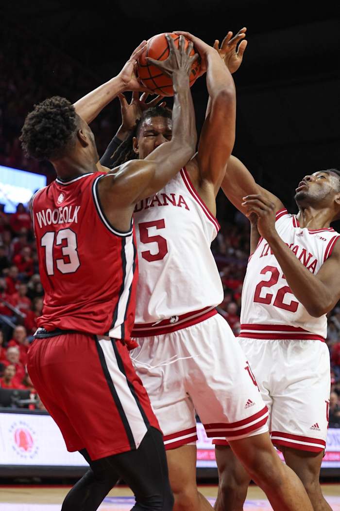 Indiana Hoosiers forward Malik Reneau (5) is tied up by Rutgers Scarlet Knights forward Antwone Woolfolk (13)