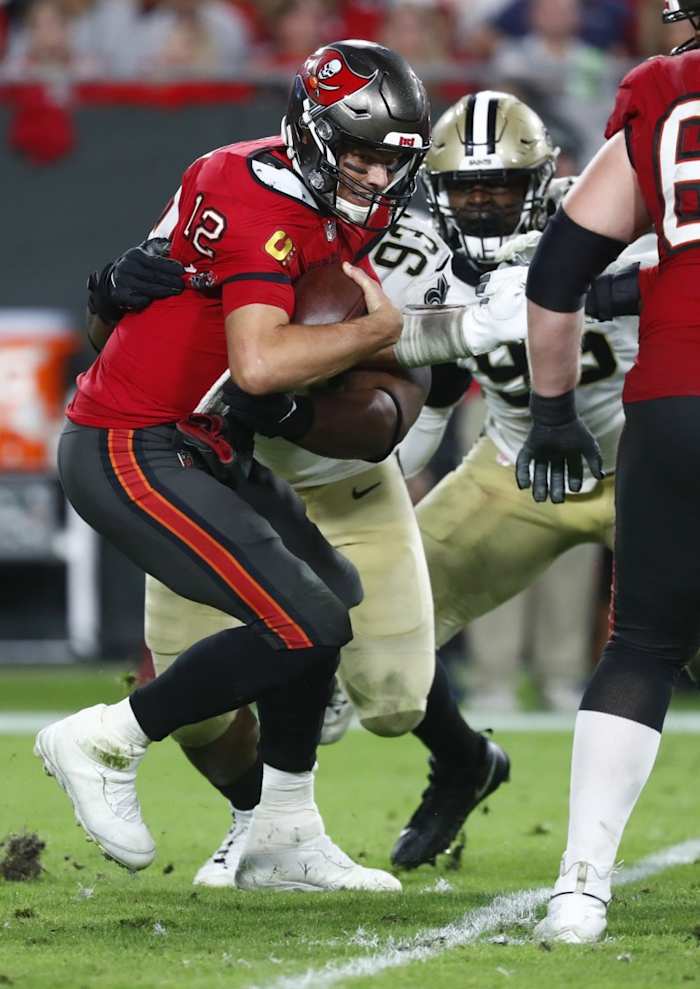 Dec 19, 2021; New Orleans Saints defensive tackle David Onyemata (93) sacks Tampa Bay Buccaneers quarterback Tom Brady (12). Mandatory Credit: Kim Klement-USA TODAY Sports