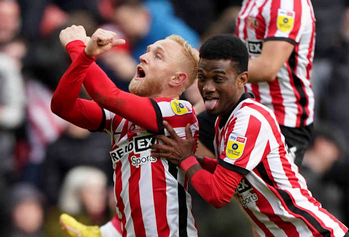 Alex Pritchard celebrates