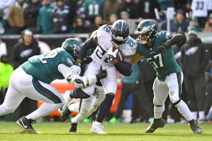 Tennessee Titans running back Derrick Henry (22) is stopped by Philadelphia Eagles defensive tackle Linval Joseph (72) and linebacker T.J. Edwards (57) during the first quarter at Lincoln Financial Field.