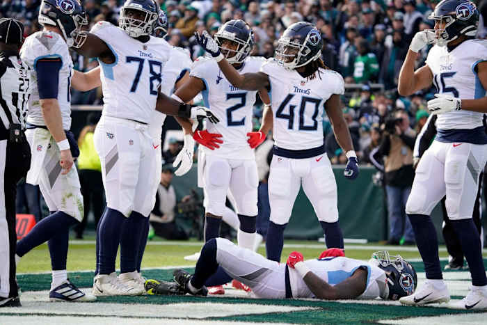 Tennessee Titans wide receiver Treylon Burks (16) lies on the field as his teammates call for trainers to assist him during the first quarter at Lincoln Financial Field Sunday, Dec. 4, 2022, in Philadelphia, Pa.