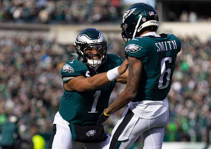 Dec 4, 2022; Philadelphia, Pennsylvania, USA; Philadelphia Eagles quarterback Jalen Hurts (1) and wide receiver DeVonta Smith (6) celebrate a touchdown connection against the Tennessee Titans during the first quarter at Lincoln Financial Field. Mandatory Credit: Bill Streicher-USA TODAY Sports