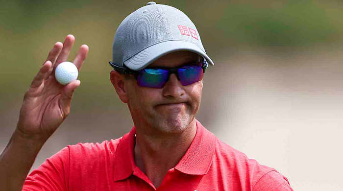 Adam Scott waves to the crowd at the 2022 Australian Open.