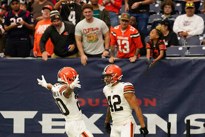 Tony Fields and Greg Newsome celebrate Fields' touchdown in the Browns' win over the Texans