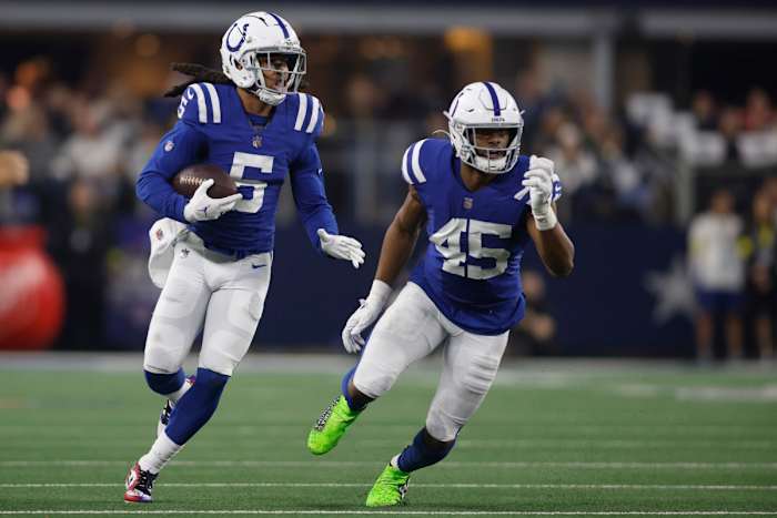Dec 4, 2022; Arlington, Texas, USA; Indianapolis Colts cornerback Stephon Gilmore (5) returns an interception as linebacker E.J. Speed (45) looks to make a block in the second quarter against the Dallas Cowboys at AT&T Stadium.