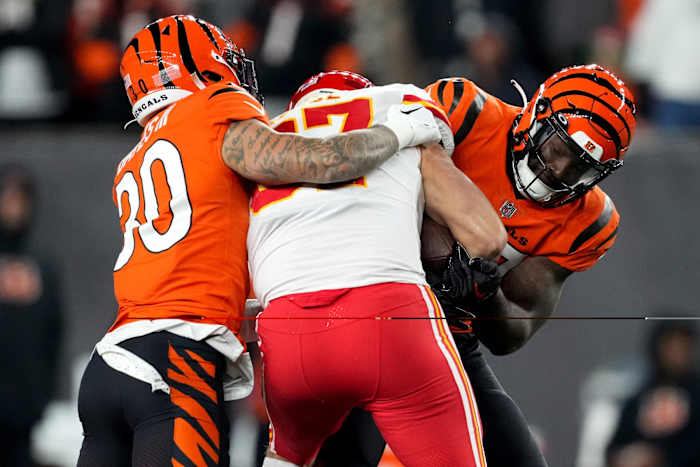 Dec 4, 2022; Cincinnati, Ohio, USA; Cincinnati Bengals linebacker Germaine Pratt (57) strips the ball from Kansas City Chiefs tight end Travis Kelce (87) for a turnover in the fourth quarter of a Week 13 NFL game at Paycor Stadium. Mandatory Credit: Kareem Elgazzar-USA TODAY Sports