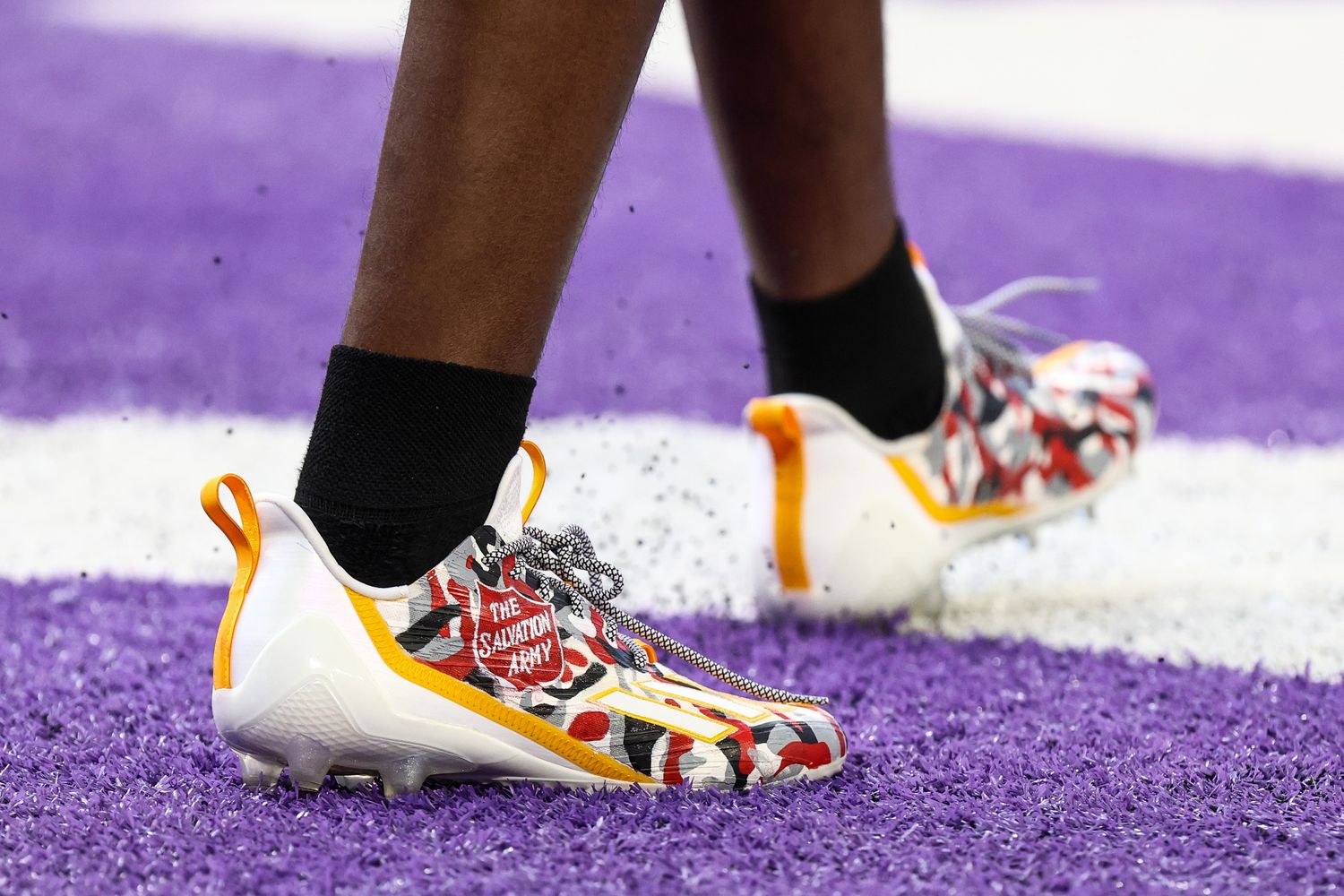 View of red and white cleats.