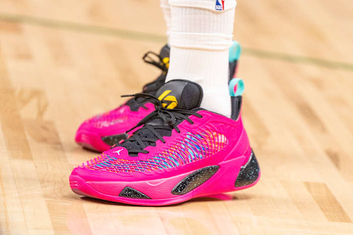 View of pink and black Jordan Luka shoes.