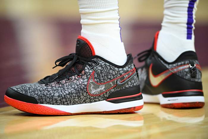 A detailed view of black and red Nike LeBron shoes.