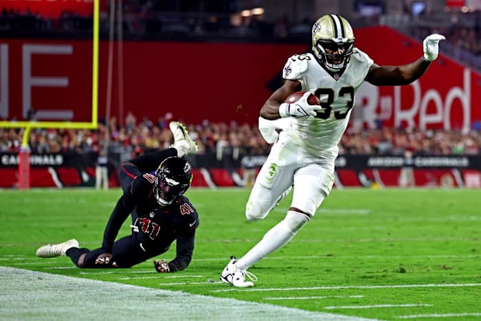 New Orleans Saints tight end Juwan Johnson (83) runs for a touchdown past Arizona Cardinals linebacker Myjai Sanders (41). Mandatory Credit: Mark J. Rebilas-USA TODAY Sports