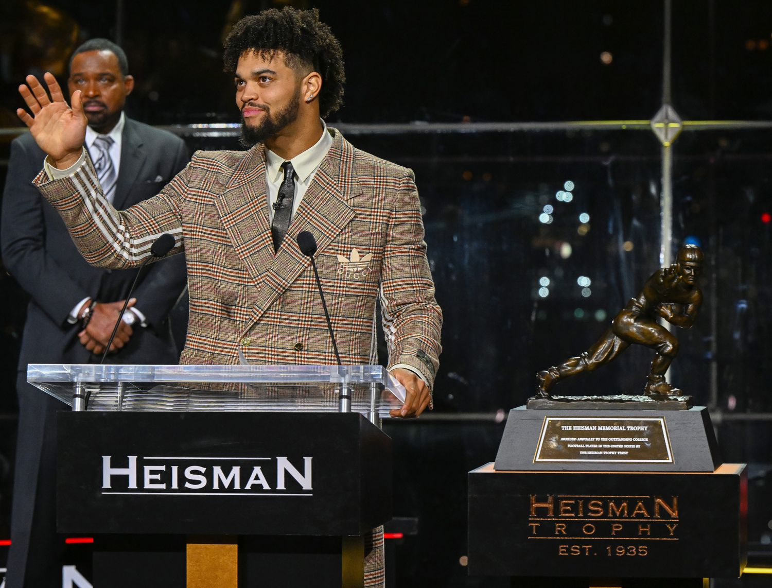Caleb Williams reacts after winning the Heisman Trophy.