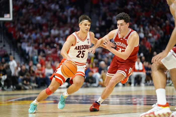 Arizona Wildcats guard Kerr Kriisa (25) drives the ball against Indiana Hoosiers guard Trey Galloway (32) during the first half at MGM Grand Garden Arena.
