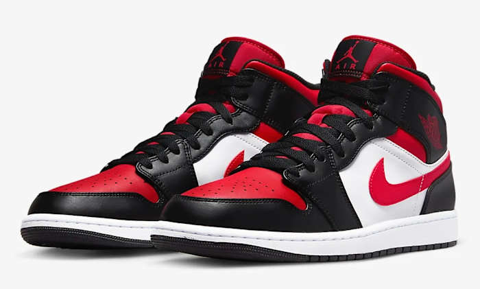 Detailed look at black and red Jordan shoes.