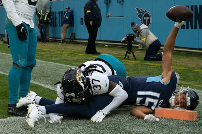 Tennessee Titans wide receiver Nick Westbrook-Ikhine (15) celebrates his touchdown catch over Jacksonville Jaguars cornerback Tre Herndon (37) during the fourth quarter at Nissan Stadium Sunday, Dec. 11, 2022, in Nashville, Tenn.