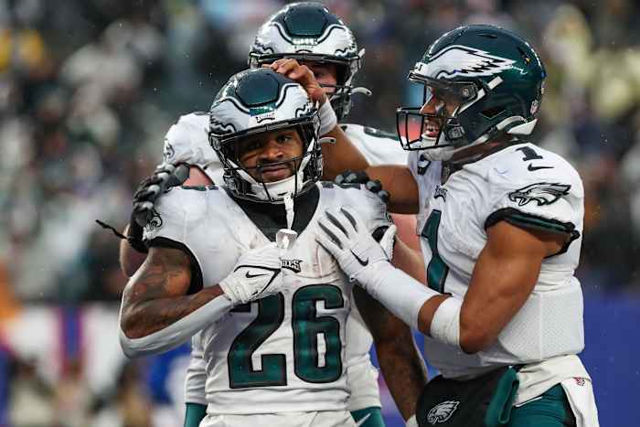 Philadelphia Eagles running back Miles Sanders (26) celebrates with quarterback Jalen Hurts (1) after scoring a touchdown against the New York Giants during the fourth quarter at MetLife Stadium.