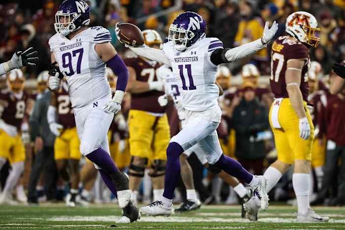 Nov 12, 2022; Minneapolis, Minnesota, USA; Northwestern Wildcats defensive back A.J. Hampton Jr. (11) celebrates a fumble recovery in the third quarter against the Minnesota Golden Gophers at Huntington Bank Stadium.