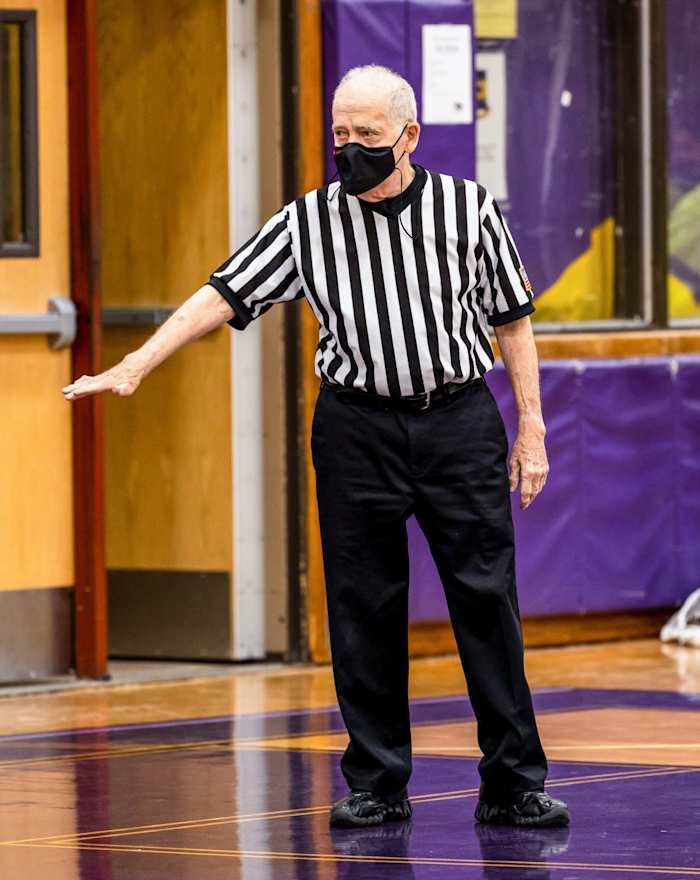 Longtime Newsday baseball writer Joe Donnelly referees a youth basketball game.