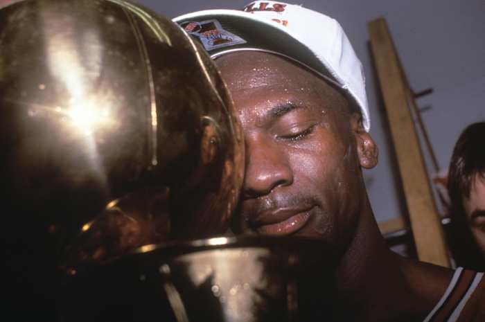 June 12, 1991; Los Angeles, CA, USA: Michael Jordan holding tight to his first NBA championship after the Chicago Bulls beat the Los Angeles Lakers in 1991 NBA Finals