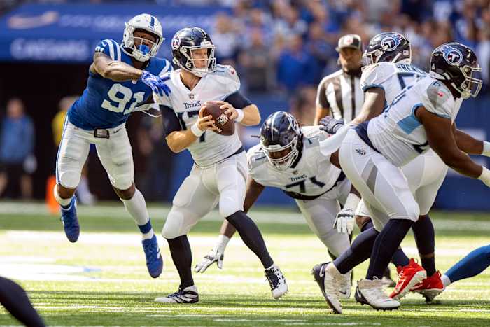 Oct 2, 2022; Indianapolis, Indiana, USA; Tennessee Titans quarterback Ryan Tannehill (17) narrowly misses being sacked by Indianapolis Colts defensive end Yannick Ngakoue (91) during the first quarter at Lucas Oil Stadium.