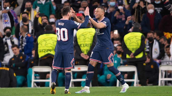 Lionel Messi and Kylian Mbappe celebrate a PSG goal in the Champions League