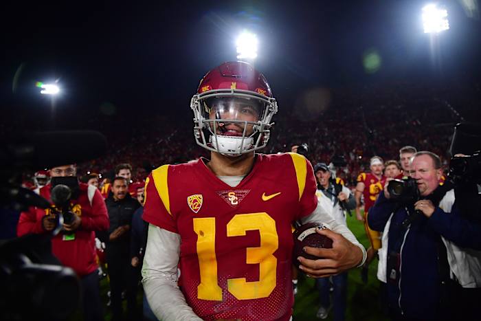 Nov 26, 2022; Los Angeles, California, USA; Southern California Trojans quarterback Caleb Williams (13) celebrates the victory against the Notre Dame Fighting Irish at the Los Angeles Memorial Coliseum. Mandatory Credit: Gary A. Vasquez-USA TODAY Sports