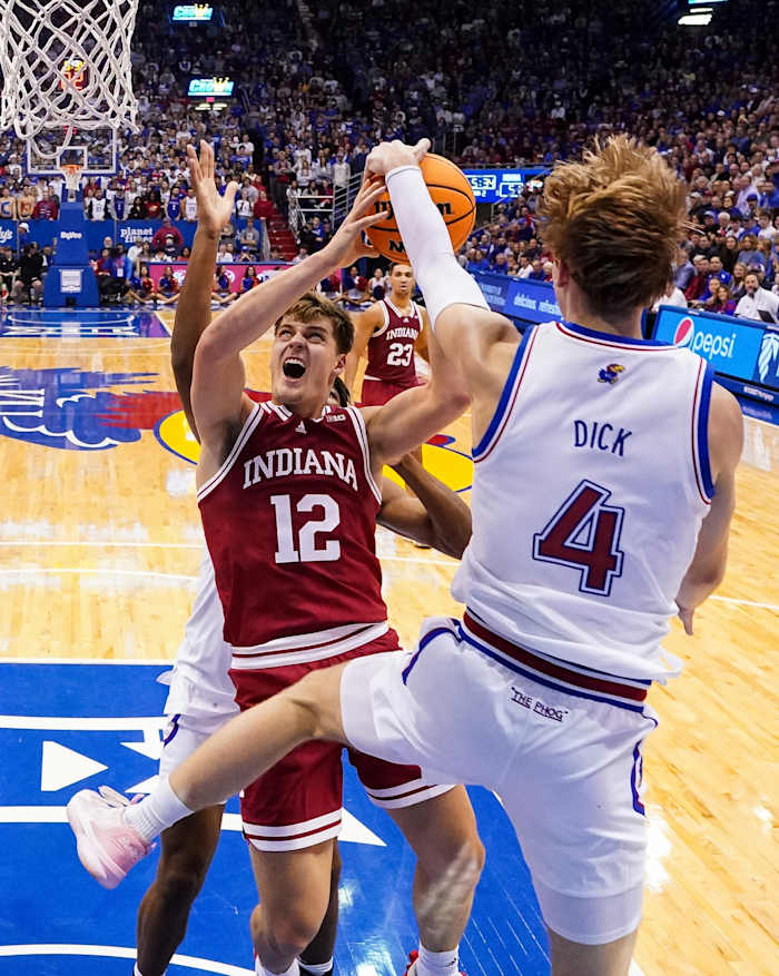 Indiana Hoosiers forward Miller Kopp (12) has his shot blocked by Kansas Jayhawks guard Gradey Dick (4) during the second half at Allen Fieldhouse.