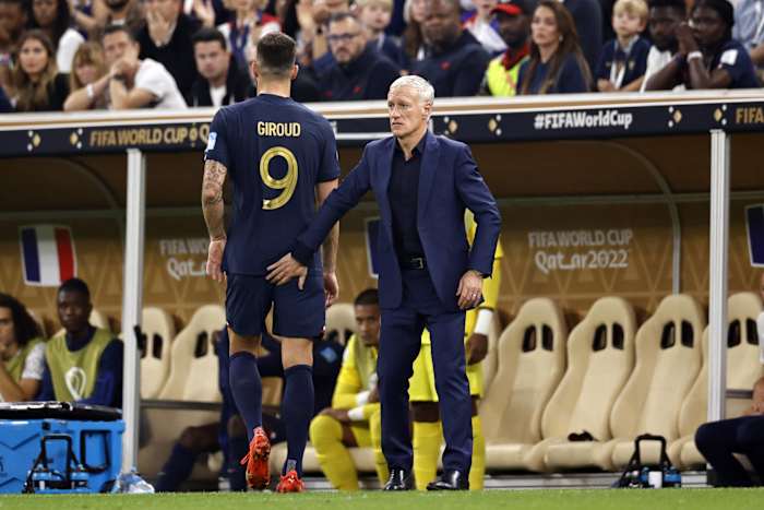 France manager Didier Deschamps pictured consoling Olivier Giroud after substituting the striker off in the first half of the 2022 FIFA World Cup final