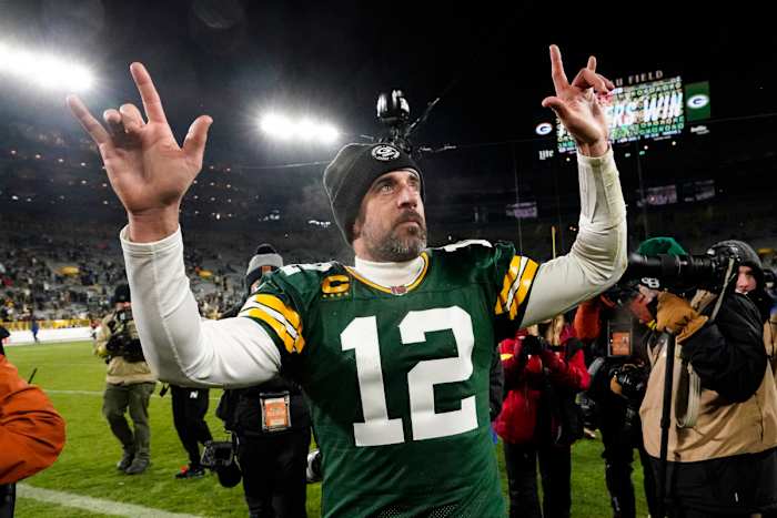 Green Bay Packers quarterback Aaron Rodgers (12) waves to fans as he leaves the field following an NFL football game against the Los Angeles Rams in Green Bay, Wis. Monday, Dec. 19, 2022. The Packers defeated the Rams 24-12.