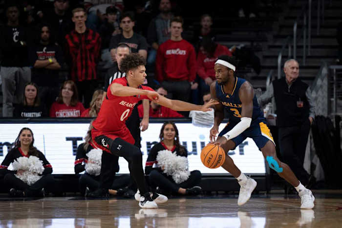 La Salle Explorers guard Anwar Gill (3) drives on Cincinnati Bearcats guard Daniel Skillings (0) in the first half of the NCAA men s basketball game between the Cincinnati Bearcats and the La Salle Explorers at Fifth Third Arena in Cincinnati on Saturday, Dec. 17, 2022. Ncaa Basketball La Salle Explorers At Cincinnati Bearcats Ac