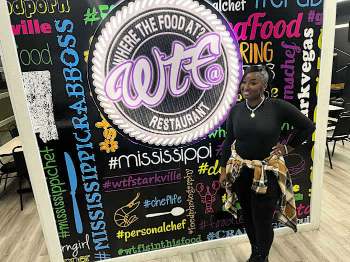 Shan Suber poses inside her restaurant, WTF