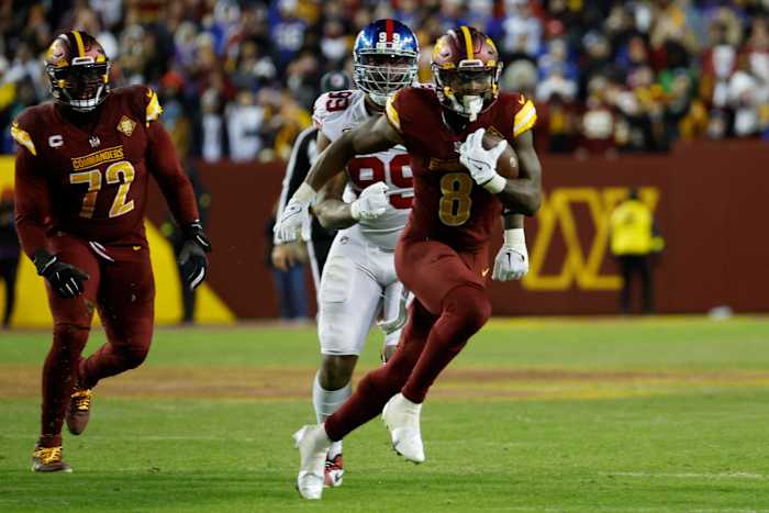 Washington Commanders running back Brian Robinson Jr. runs the ball against the New York Giants.