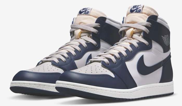 View of navy and grey Air Jordan shoes.