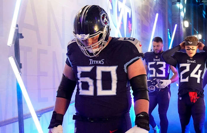 Tennessee Titans center Ben Jones (60) and other teammates head to the field to face the Bengals during the AFC Divisional playoff game at Nissan Stadium Saturday, Jan. 22, 2022 in Nashville, Tenn.